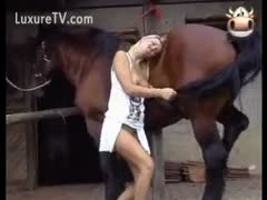 Fantastic blond beastiality newcomer licking and blowing a horse 